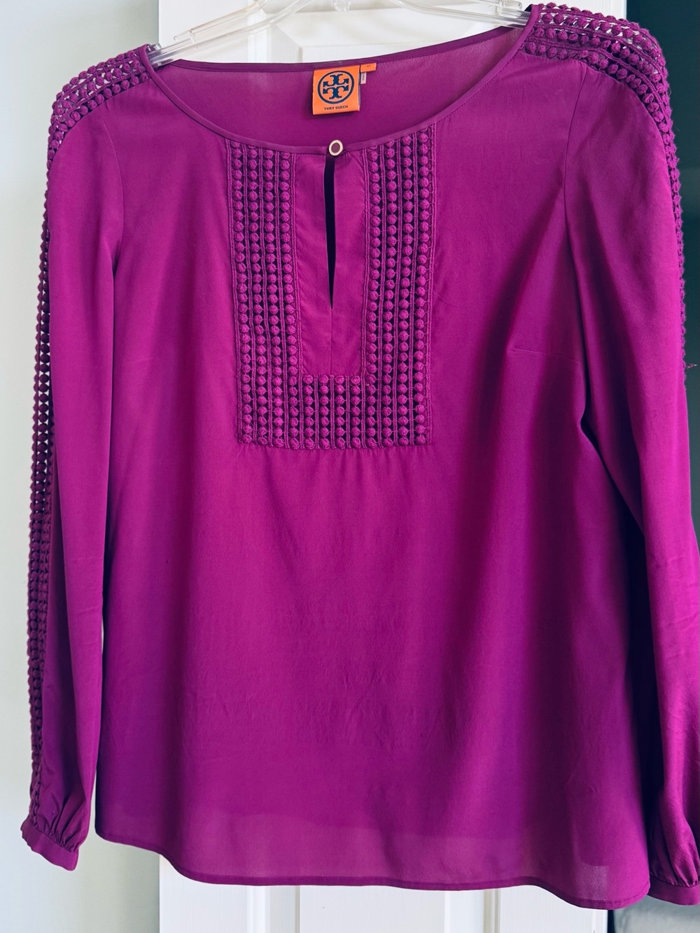 Tory Burch Fuchsia silk blouse with crochet detail on front and down sleeves